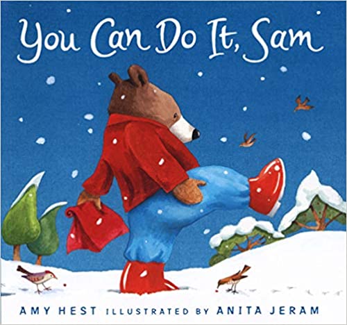 Front cover image of a little bear with a red coat and red boots carrying a red package through the snow