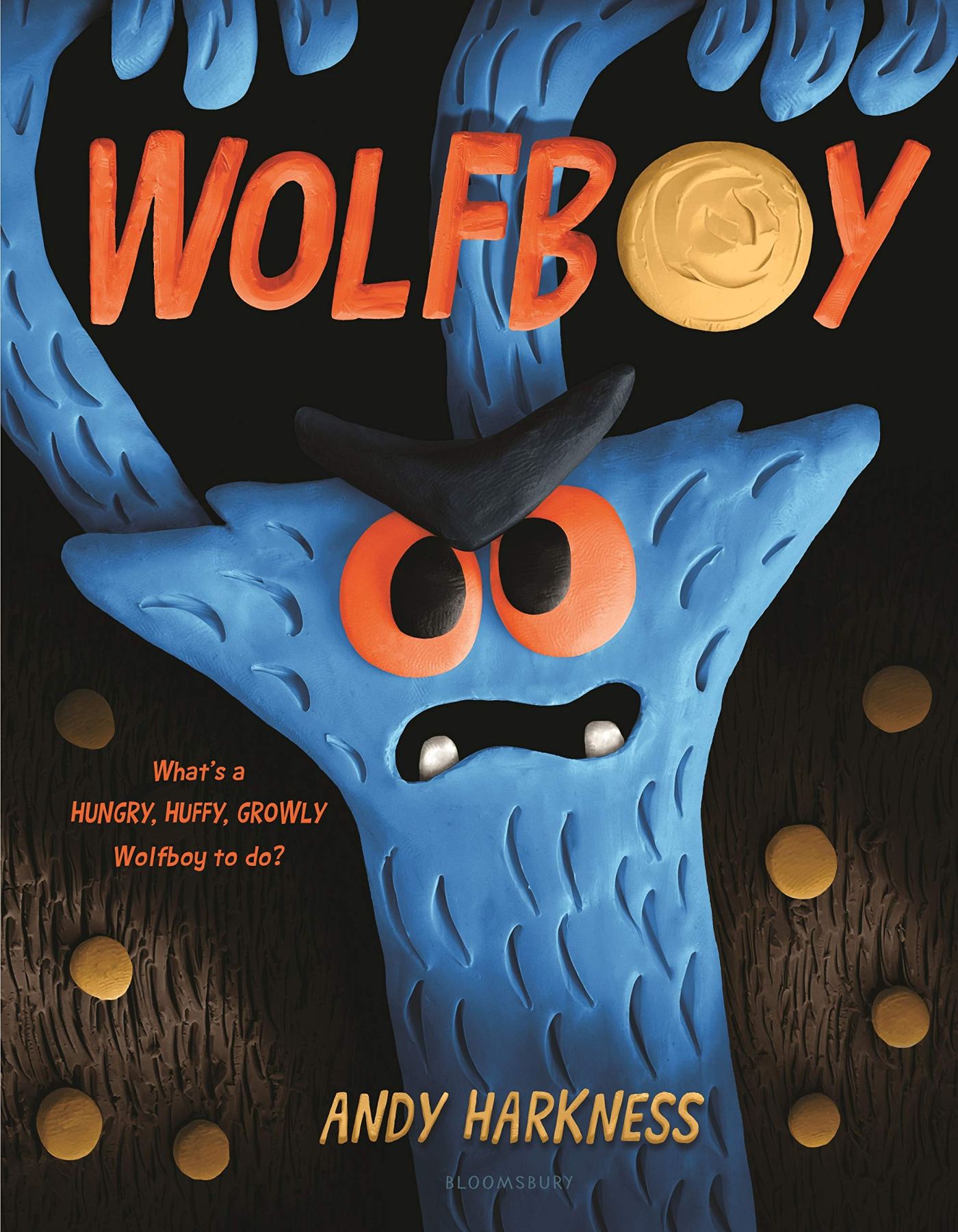Front cover image of WolfBoy of a blue plastercine wolf with red eyes and two blue teeth with this hands above his head.