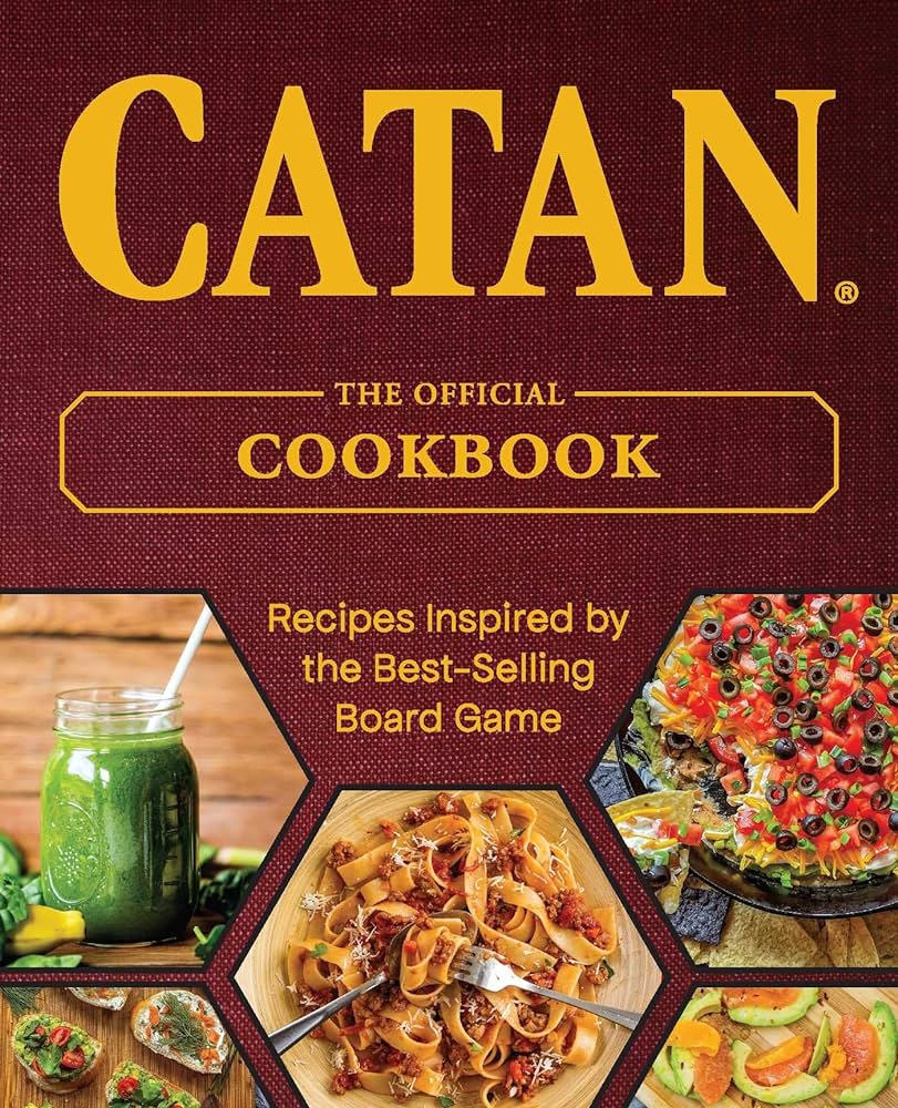 Front cover image of Catan, the Official Cookbook with pictues of smoothies, pasta, dip, and vegetables in hexagon-shaped cutouts